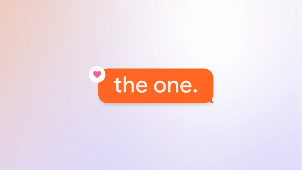 An orange message bubble reading the one, with a pink heart reaction