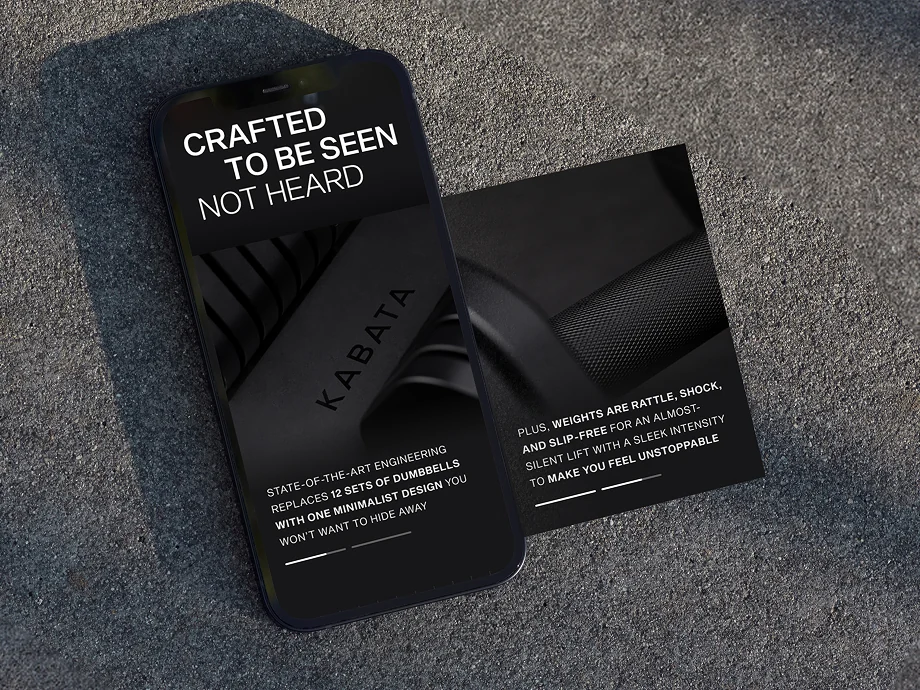 Two dark Kabata cards on asphalt, Crafted to be seen not heard set over the weight stack